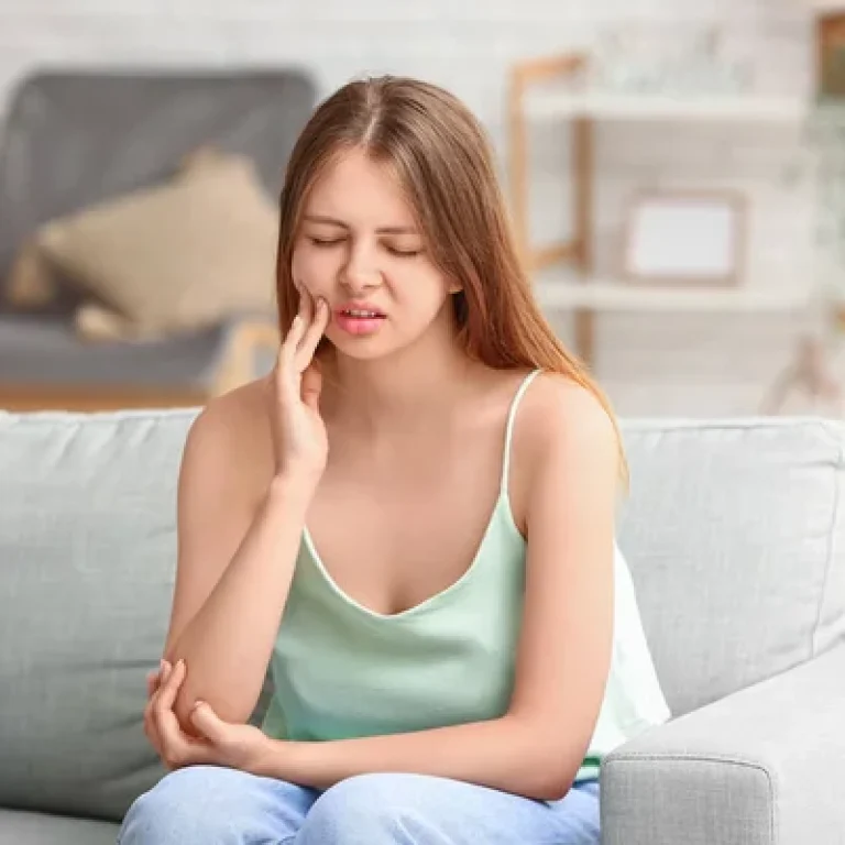 depositphotos_679224514-stock-photo-young-woman-suffering-toothache-home